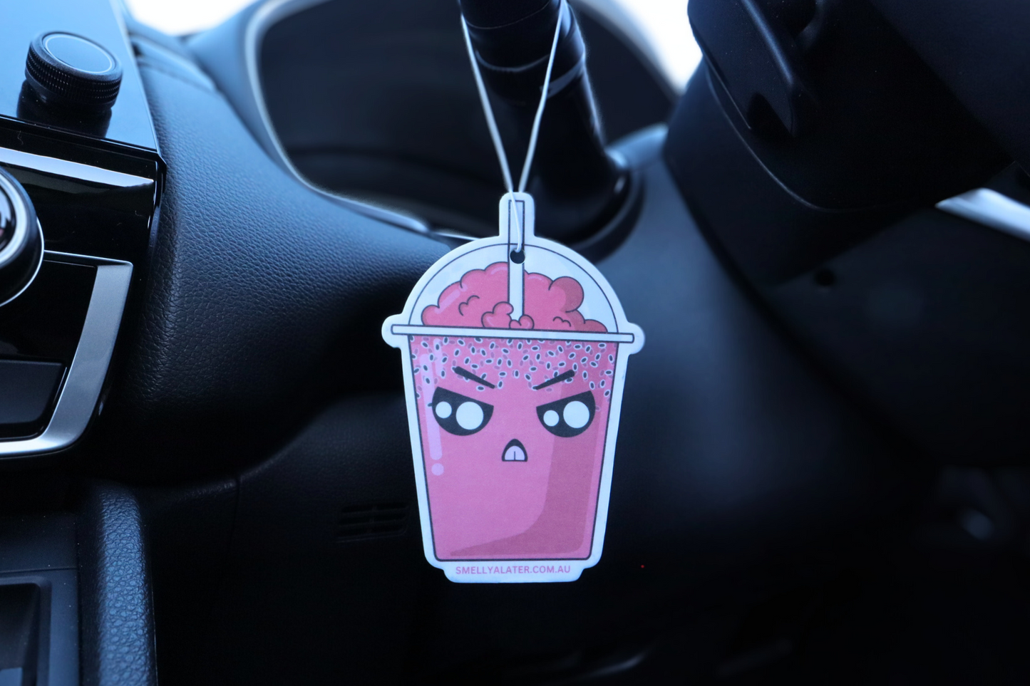 Cute, angry red boba/bubble tea with chia seeds, red bubbly froth and big sparkling eyes, hung in a cool black interior car. Smell Ya Later - Scented Air Freshener. Suitable for homes, wardrobes, cupboards, bathrooms, cars, office space, pet rooms, bed rooms, kitchen.